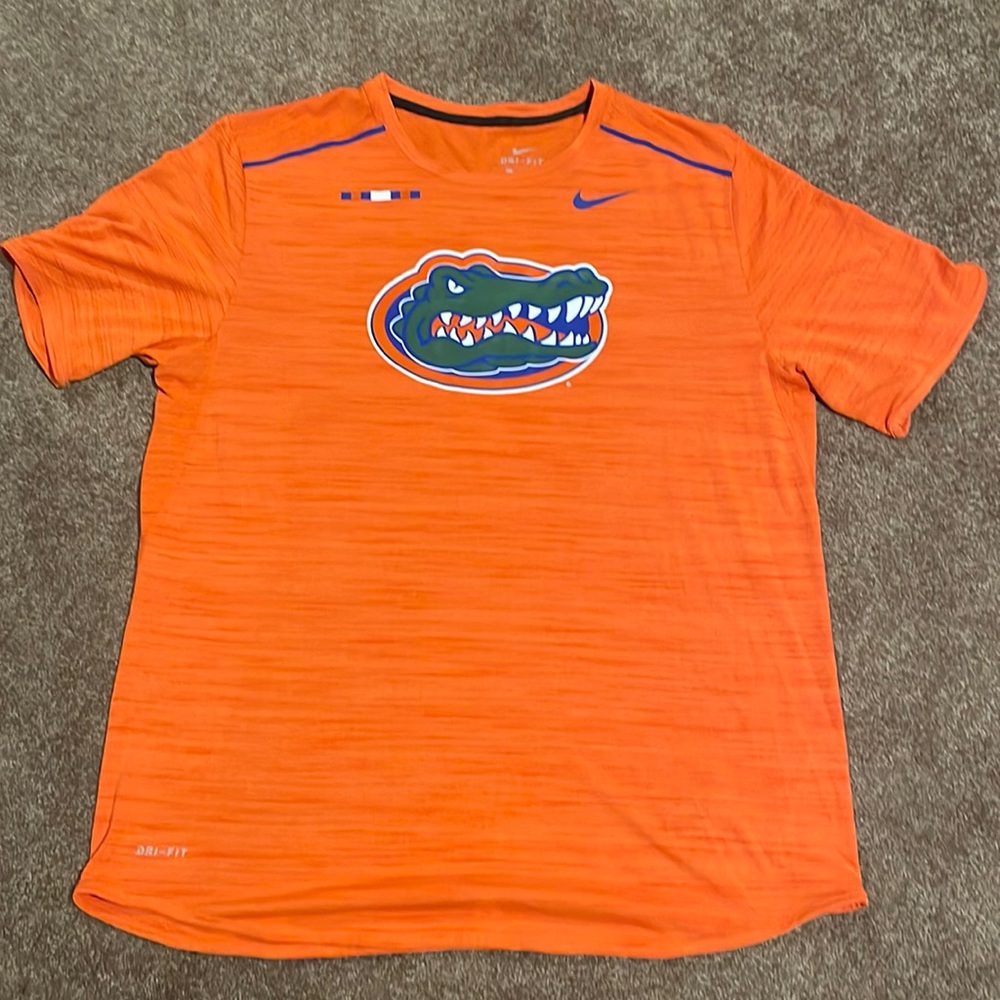 Nike dri-fit workout T-shirt. Never worn. Colors orange and blue.